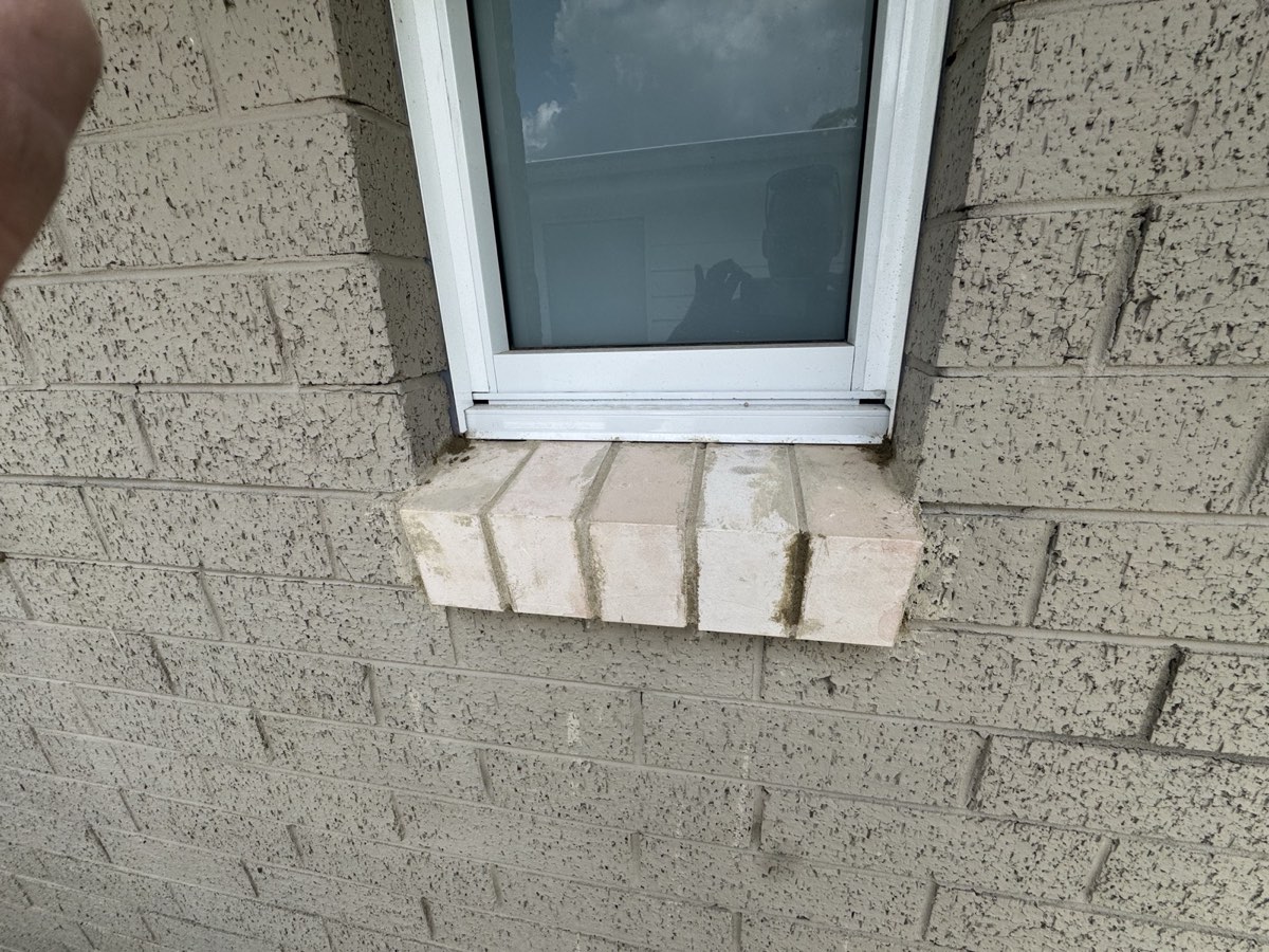 Repaired brick window sill